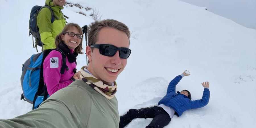 Young people on snowy mountain