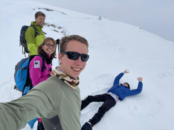 Young people on snowy mountain